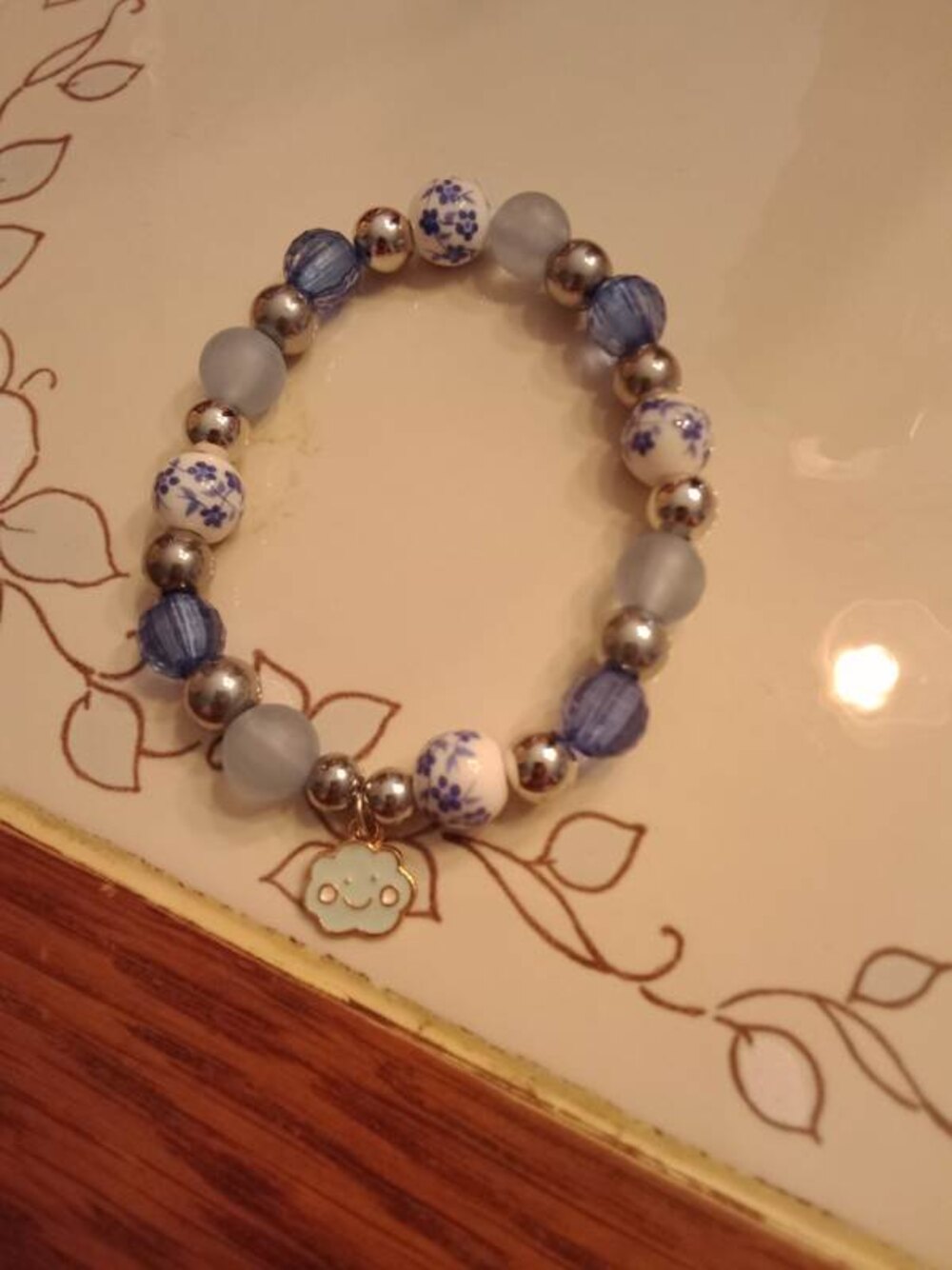 Handmade beaded bracelet with blue and white floral beads by Javonna's Crafts